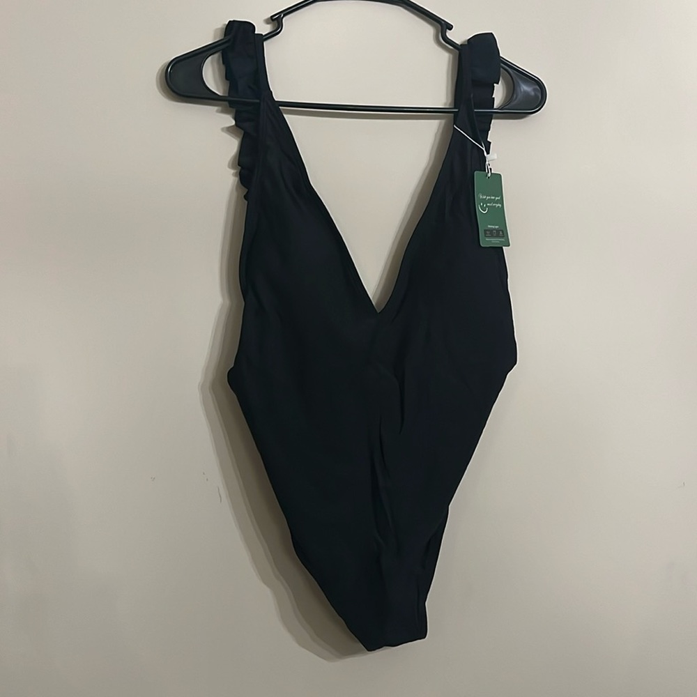 NWT medium women’s black one piece suit with ruffled straps